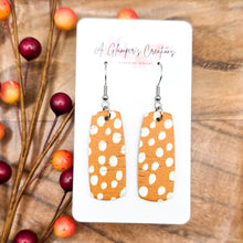 Load image into Gallery viewer, White Dots on Orange Mini Bar Earrings
