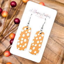 Load image into Gallery viewer, White Dots on Orange Mini Bar Earrings